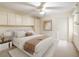 Bedroom featuring overhead storage, a cozy bed, and a soft color scheme at 6201 Amaretto Ln # 6201, Tampa, FL 33634