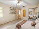 Bedroom showcasing built-in shelves, a mirrored closet, and comfortable design elements at 6201 Amaretto Ln # 6201, Tampa, FL 33634