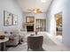 Comfortable living room with a brick fireplace, ceiling fan and natural light at 6201 Amaretto Ln # 6201, Tampa, FL 33634