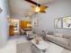 Open-concept living area connecting dining area with the bright living room at 6201 Amaretto Ln # 6201, Tampa, FL 33634
