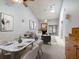 Open living space featuring a dining area, stylish living room with a fireplace and skylights at 6201 Amaretto Ln # 6201, Tampa, FL 33634