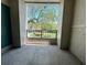 Relaxing balcony with wrought iron railing, overlooking landscaped grounds and mature tree at 622 Seascape Way, Tampa, FL 33602