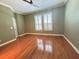 Bedroom with wood floors, a ceiling fan, crown moulding and plantation shutters on the windows at 622 Seascape Way, Tampa, FL 33602