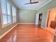 Bedroom featuring wood floors, plantation shutters on the windows and an ensuite bathroom at 622 Seascape Way, Tampa, FL 33602