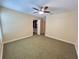 Bedroom with olive carpeting, open closet, and neutral walls at 622 Seascape Way, Tampa, FL 33602