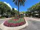 Community entrance sign surrounded by colorful flowers and lush landscaping at 622 Seascape Way, Tampa, FL 33602