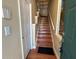 Entryway features hardwood floors, staircase and white interior door at 622 Seascape Way, Tampa, FL 33602
