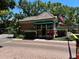 Charming guard house with brick facade, tile roof, and American flag at 622 Seascape Way, Tampa, FL 33602
