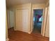 Hallway featuring wood floors and access to different rooms at 622 Seascape Way, Tampa, FL 33602