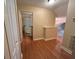 Upstairs hallway featuring wood floors and an open doorway to the bathroom at 622 Seascape Way, Tampa, FL 33602