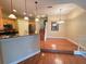 Open-concept kitchen featuring stainless appliances and granite countertops open to dining area at 622 Seascape Way, Tampa, FL 33602