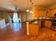 Kitchen featuring granite countertops and stainless appliances open to the living room and stairway at 622 Seascape Way, Tampa, FL 33602