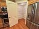 Bright kitchen showcasing stainless steel appliances and a pantry with shelving at 622 Seascape Way, Tampa, FL 33602