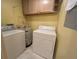 Laundry room with standard washer, dryer, and water heater at 622 Seascape Way, Tampa, FL 33602