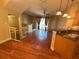 Living room with open floor plan, wood floors, and slider doors to deck at 622 Seascape Way, Tampa, FL 33602