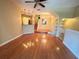 Living room view features hardwood floors and an open floor plan into the kitchen and stairway at 622 Seascape Way, Tampa, FL 33602