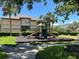 Community playground area with slides and climbing structures, with condo building nearby at 622 Seascape Way, Tampa, FL 33602