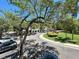 Picture of the neighborhood street leading to a building with well-maintained lawns and plenty of parking at 622 Seascape Way, Tampa, FL 33602