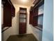 Walk-in closet featuring custom wood shelving and ample storage space at 622 Seascape Way, Tampa, FL 33602