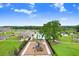 An aerial view of the community pool and park, showcasing recreational amenities at 6384 Ten Acre Ct, Zephyrhills, FL 33541