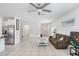 Spacious living room featuring tile floors, bright lighting, and neutral paint at 6384 Ten Acre Ct, Zephyrhills, FL 33541