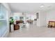 Spacious living room featuring tile floors, bright lighting, and neutral paint at 6384 Ten Acre Ct, Zephyrhills, FL 33541