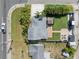 Bird's-eye view of house with grassy yard, patio, and parking at 656 40Th Ne Ave, St Petersburg, FL 33703