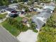 Aerial view of home featuring a well-kept lawn, patio area, and parking for vehicles at 656 40Th Ne Ave, St Petersburg, FL 33703