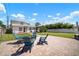 Spacious backyard with a brick patio, comfortable seating, and a well-manicured lawn at 656 40Th Ne Ave, St Petersburg, FL 33703