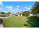 Expansive backyard with lush green lawn, gazebo, fire pit area, creating perfect outdoor living and entertaining at 656 40Th Ne Ave, St Petersburg, FL 33703