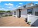 Charming backyard with a wooden deck, beautifully trimmed landscaping, and serene outdoor living space at 656 40Th Ne Ave, St Petersburg, FL 33703