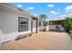 Exterior backyard view of white house with wood deck and covered patio at 656 40Th Ne Ave, St Petersburg, FL 33703