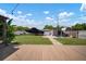 A beautiful backyard with a wooden deck, well-maintained lawn, covered boat, shed, and inviting outdoor seating at 656 40Th Ne Ave, St Petersburg, FL 33703
