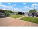 Spacious backyard featuring a wooden deck, green lawn, boat, shed, and a charming gazebo with outdoor seating at 656 40Th Ne Ave, St Petersburg, FL 33703