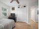 Bright bedroom with ceiling fan, closet, and wood-look flooring at 656 40Th Ne Ave, St Petersburg, FL 33703