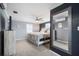 Bedroom featuring neutral tones, a ceiling fan, and a large mirror on the wall at 656 40Th Ne Ave, St Petersburg, FL 33703