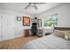 Bright bedroom with wood-look floors, desk, and sport decor at 656 40Th Ne Ave, St Petersburg, FL 33703