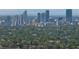 A distant aerial view of a city featuring modern buildings surrounded by lush trees at 656 40Th Ne Ave, St Petersburg, FL 33703