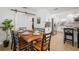 Open dining room with a table next to a clean, bright kitchen with white cabinets at 656 40Th Ne Ave, St Petersburg, FL 33703