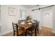 Bright dining room features a wood table, barn door, and light wood flooring at 656 40Th Ne Ave, St Petersburg, FL 33703