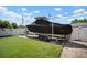 Driveway leads to backyard with boat, showcasing ample parking and lawn space; modern amenities and convenience at 656 40Th Ne Ave, St Petersburg, FL 33703