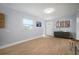 Neat foyer with a large window, neutral paint, and light hardwood floors at 656 40Th Ne Ave, St Petersburg, FL 33703