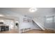 Inviting entryway with stylish décor, open staircase and light hardwood floors at 656 40Th Ne Ave, St Petersburg, FL 33703