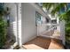 Charming exterior of home with white picket fence, wooden porch and ramp, and well maintained landscaping at 656 40Th Ne Ave, St Petersburg, FL 33703
