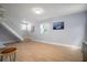 Open concept living area with an staircase, bright window and light hardwood floors at 656 40Th Ne Ave, St Petersburg, FL 33703
