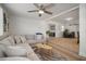 Bright living room with a sectional sofa and open floor plan at 656 40Th Ne Ave, St Petersburg, FL 33703