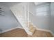 Bright white staircase with a wooden steps and neutral paint colors at 656 40Th Ne Ave, St Petersburg, FL 33703