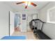 A sunlit bedroom with tile flooring and a mirrored closet at 6982 78Th N Ave, Pinellas Park, FL 33781