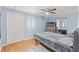 This blue bedroom features laminate flooring and natural lighting at 6982 78Th N Ave, Pinellas Park, FL 33781