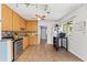 Bright kitchen with tile floors, wood cabinets, stainless steel appliances, and views to the back yard at 6982 78Th N Ave, Pinellas Park, FL 33781